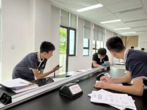 Students in lab with lab reports