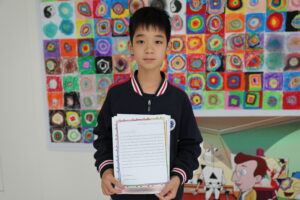 Student with Pen Pal letter