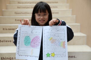 Student with Pen Pal letter