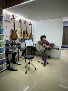 Kid playing guitar